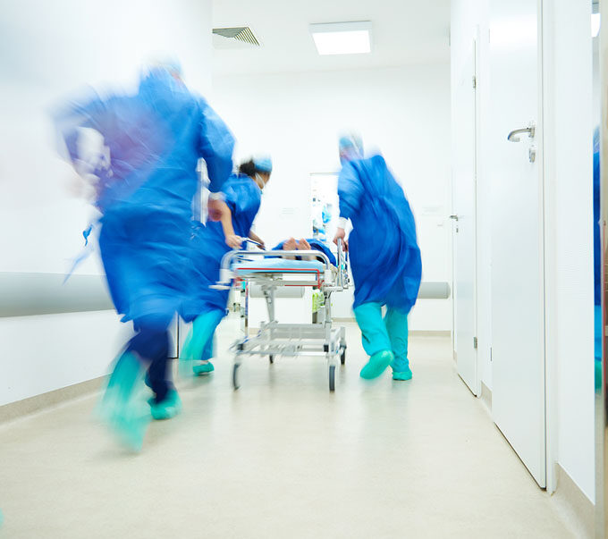 medical staff rushing to action during a medical emergency