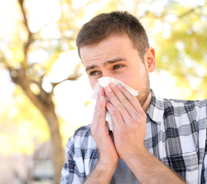 Man blowing his nose