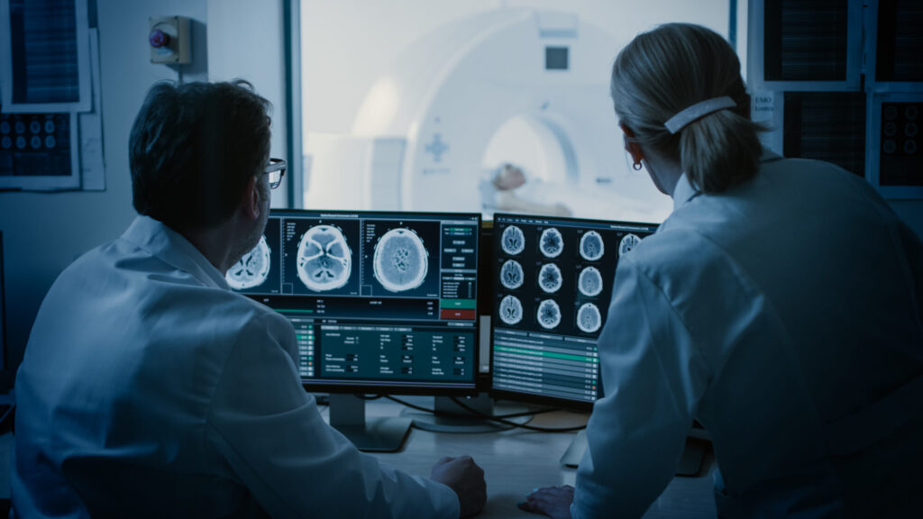 doctors looking at images of medical scans